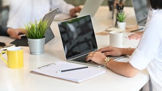 female-startup-working-her-project-with-laptop-meeting-room